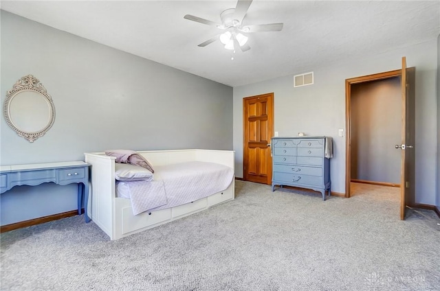 bedroom featuring baseboards, visible vents, carpet floors, and ceiling fan