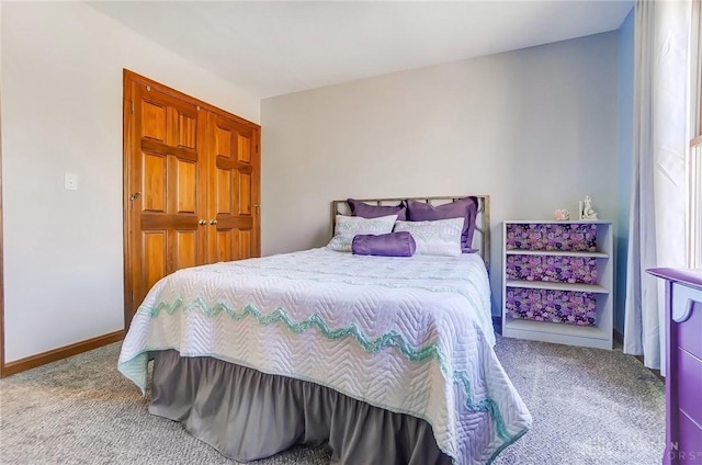 carpeted bedroom with baseboards