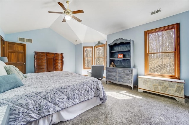 bedroom featuring visible vents, ceiling fan, lofted ceiling, and carpet floors