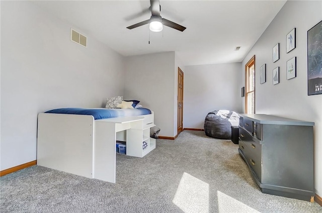 bedroom featuring visible vents, a ceiling fan, baseboards, and carpet floors