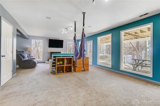 game room featuring carpet, visible vents, and baseboards