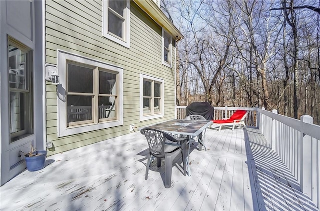 wooden deck with outdoor dining area