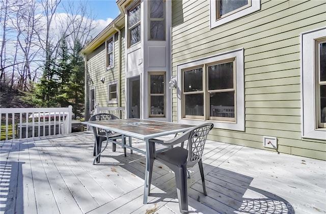 deck with outdoor dining space