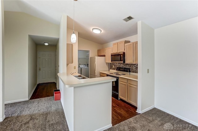 kitchen with stainless steel microwave, visible vents, freestanding refrigerator, electric range, and separate washer and dryer