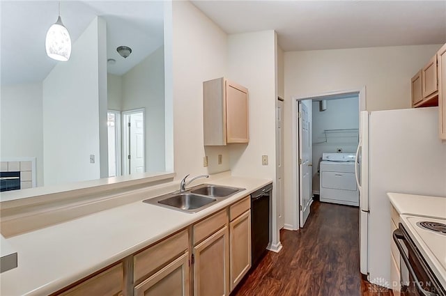 kitchen featuring a sink, dark wood-style floors, white appliances, light countertops, and washer / dryer