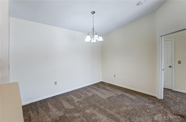 carpeted spare room with baseboards and a notable chandelier