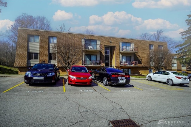 view of property with uncovered parking
