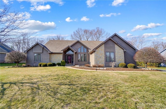 mid-century inspired home with stone siding, a shingled roof, and a front lawn