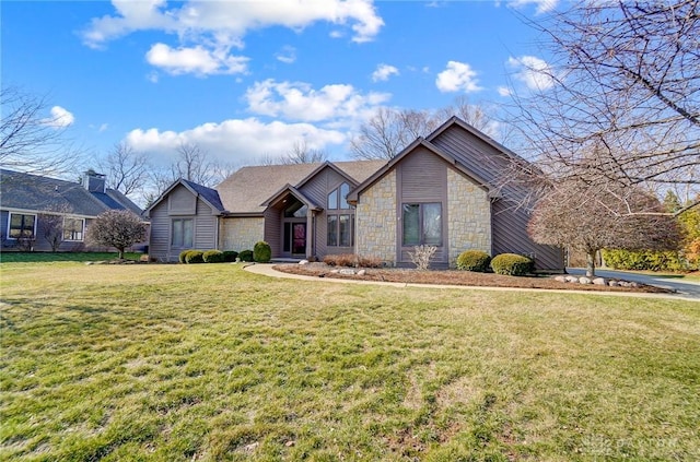 mid-century home with stone siding and a front yard