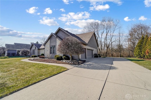 view of home's exterior featuring a yard, an attached garage, and driveway