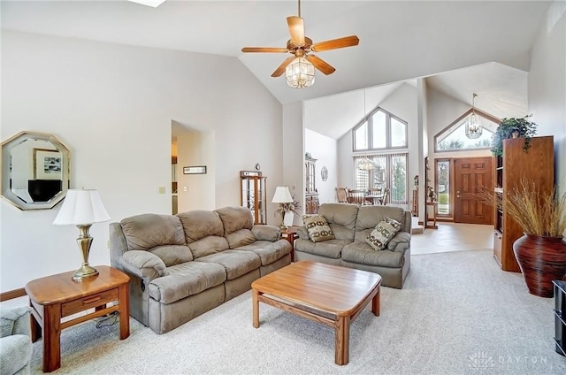 living area featuring light carpet, high vaulted ceiling, and ceiling fan