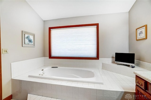 bathroom featuring a bath and vanity