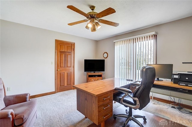 home office with baseboards, carpet floors, and ceiling fan