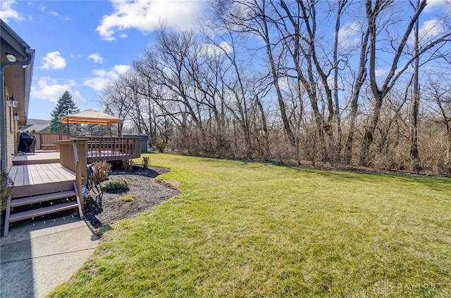 view of yard featuring a wooden deck