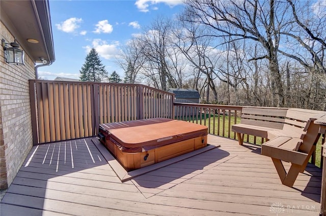 deck with a covered hot tub