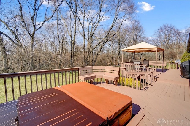 deck featuring a gazebo and a lawn