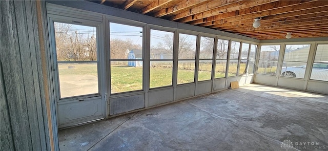 unfurnished sunroom featuring a healthy amount of sunlight