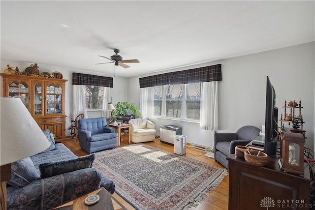 living room featuring wood finished floors and ceiling fan