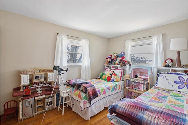 bedroom with wood finished floors