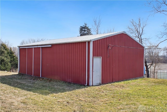 view of pole building with a yard