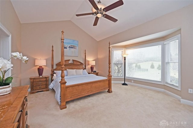 bedroom featuring baseboards, lofted ceiling, light colored carpet, and ceiling fan