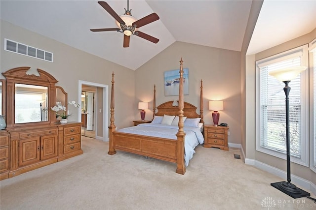 bedroom with lofted ceiling, baseboards, visible vents, and light carpet