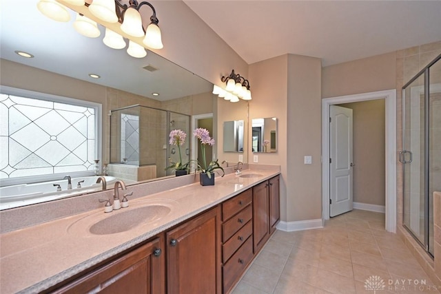 full bath with tile patterned flooring, a shower stall, double vanity, and a sink