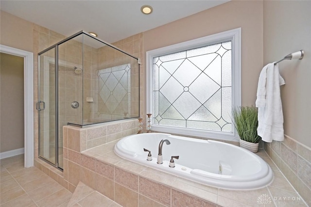 full bath with a bath, a stall shower, and tile patterned flooring