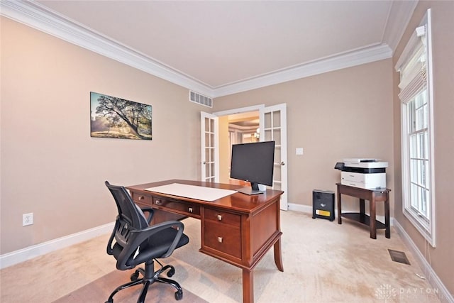 office featuring a wealth of natural light, visible vents, and crown molding