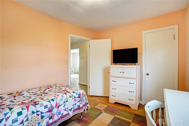 bedroom with light wood-style floors