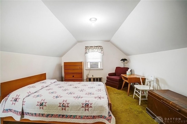 bedroom featuring cooling unit, lofted ceiling, and carpet floors