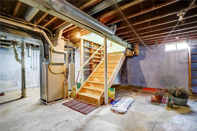 basement with stairs and heating unit