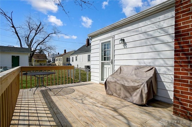 wooden terrace with a residential view