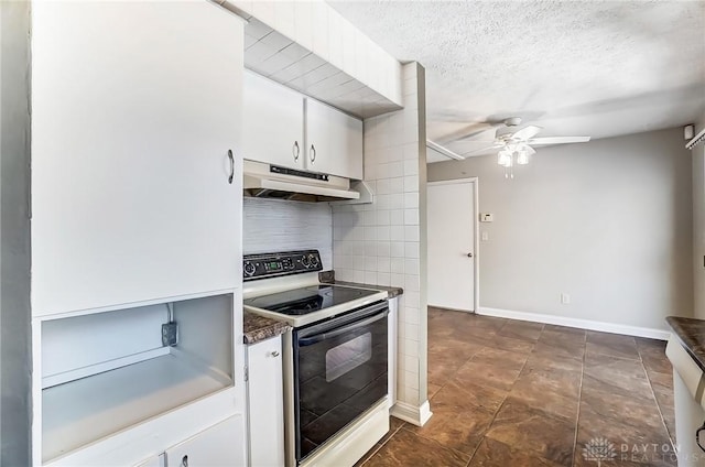 kitchen with range with electric stovetop, white cabinets, under cabinet range hood, a textured ceiling, and backsplash