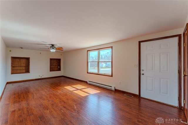 unfurnished living room with baseboards, baseboard heating, wood finished floors, and a ceiling fan