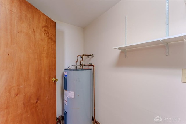 utility room with electric water heater