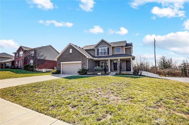 traditional-style home featuring brick siding, driveway, a front lawn, and fence