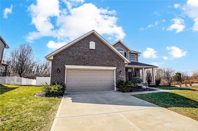 traditional-style home featuring a front yard, fence, an attached garage, concrete driveway, and brick siding