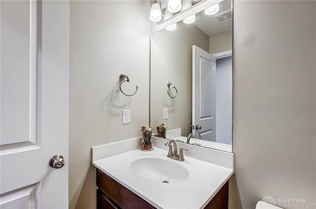 bathroom featuring vanity and visible vents