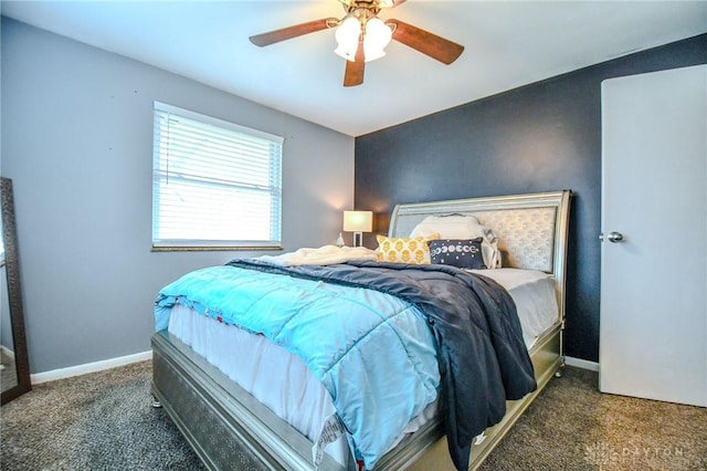 carpeted bedroom featuring baseboards and ceiling fan