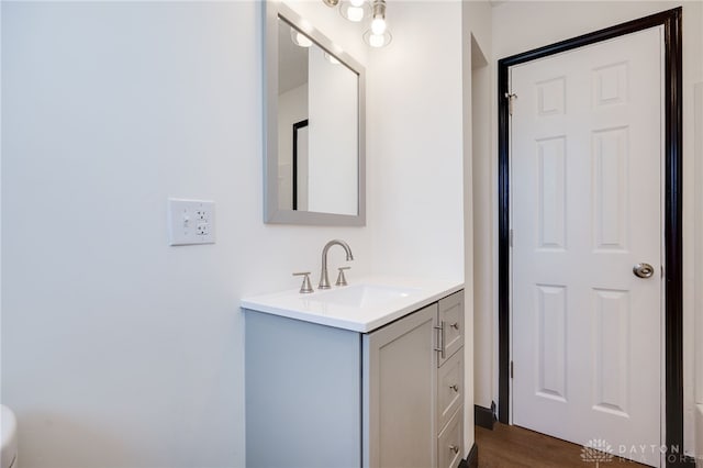 bathroom featuring vanity and wood finished floors