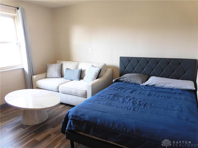 bedroom featuring wood finished floors