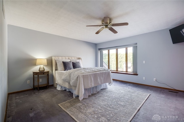 bedroom featuring baseboards, carpet floors, visible vents, and ceiling fan