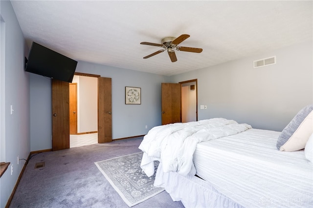 bedroom featuring visible vents, baseboards, a ceiling fan, and carpet flooring