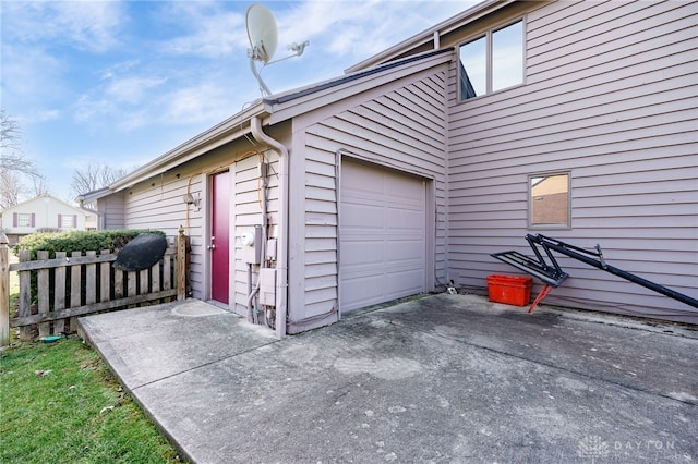 garage with fence