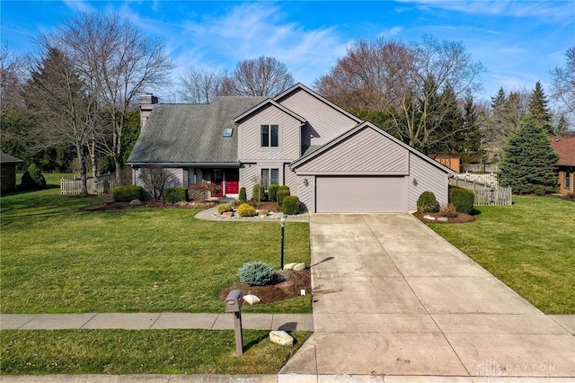 view of front of property featuring concrete driveway, an attached garage, fence, and a front yard