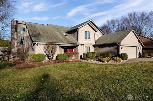 view of front of house featuring driveway, fence, roof with shingles, a front yard, and a garage