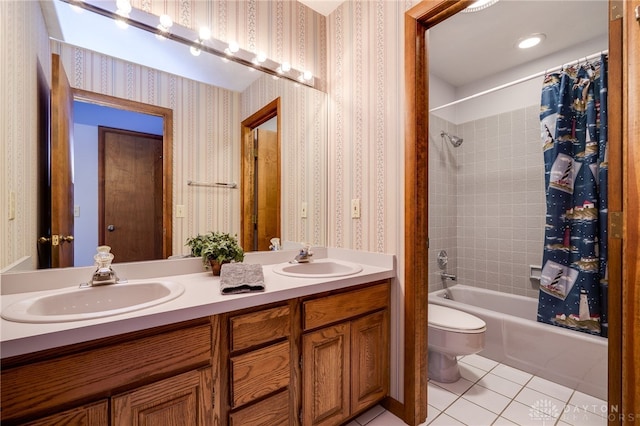 full bath with tile patterned floors, wallpapered walls, and a sink