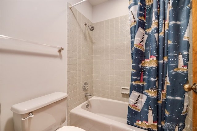 full bathroom featuring shower / bath combo with shower curtain and toilet