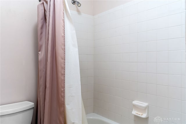 full bathroom with toilet and shower / bath combination with curtain